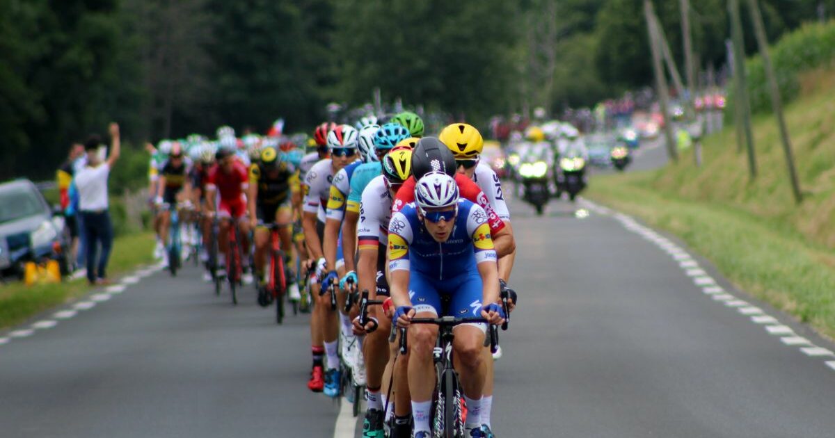 A view head on of cyclists in a road race.